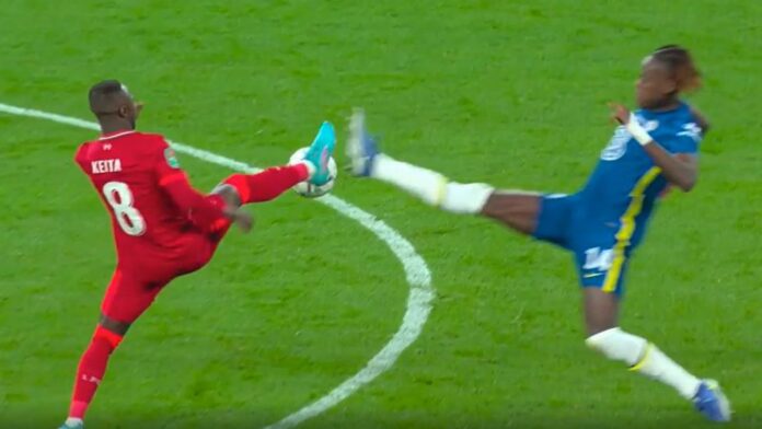 Naby Keita stretches for the ball with Chelsea&#39;s Trevoh Calobah
