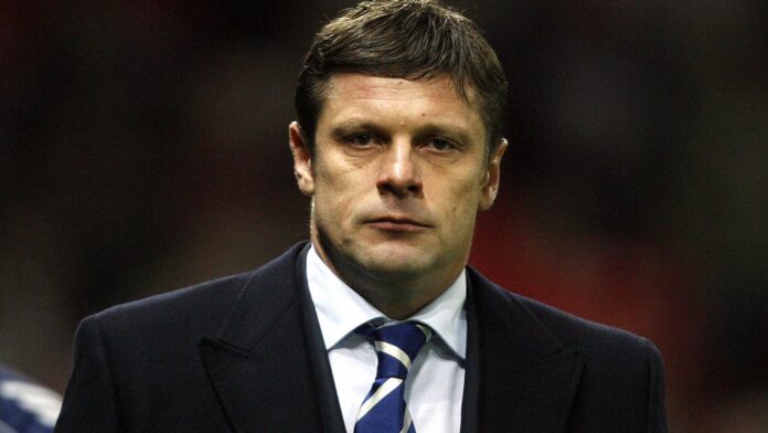 Dynamo Kiev manager Oleg Luzhny walks to the dugout before his team took on Manchester United in their UEFA Champions League football match at Old Trafford, Manchester, north west England, 07 November 2007. AFP PHOTO/ANDREW YATES (Photo credit should read ANDREW YATES/AFP via Getty Images)