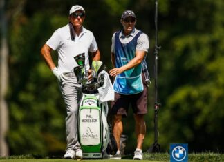 Phil Mickelson and the caddy on the seventh hole during the first round of the 2023 BMW Golf Championship.
