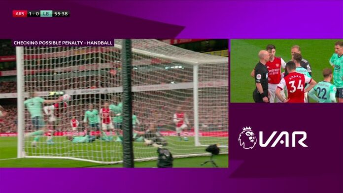The VAR checks for a handball by Caglar Soyuncu