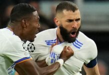 Real Madrid's David Alaba celebrates Karim Benzema, who scored his team's first goal