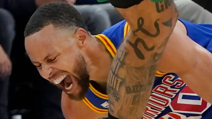 Golden State Warriors guard Stephen Curry was injured in Wednesday&#39;s loss to the Boston Celtics (AP)