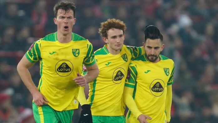 Lukas Robb celebrates after closing the gap for Norwich at Anfield