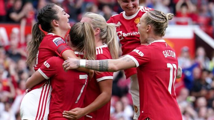 Katie Zelm has been attacked by her teammates after giving Manchester United a 2-1 lead with a penalty