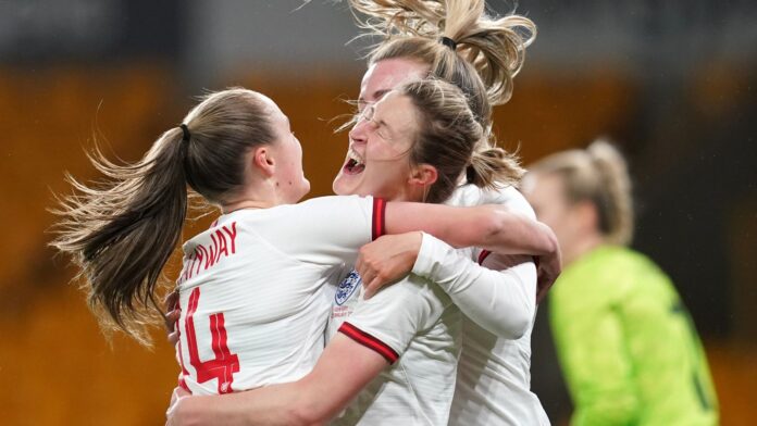 Ellen White (centre) celebrates with Georgia Stanway (left) after scoring England&#39;s first goal of the game during the Arnold Clark Cup match against Germany
