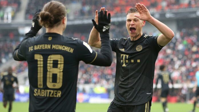 Joshua Kimmich celebrates with Marcel Sabitzer during Bayern&#39;s 4-1 win at Freiburg