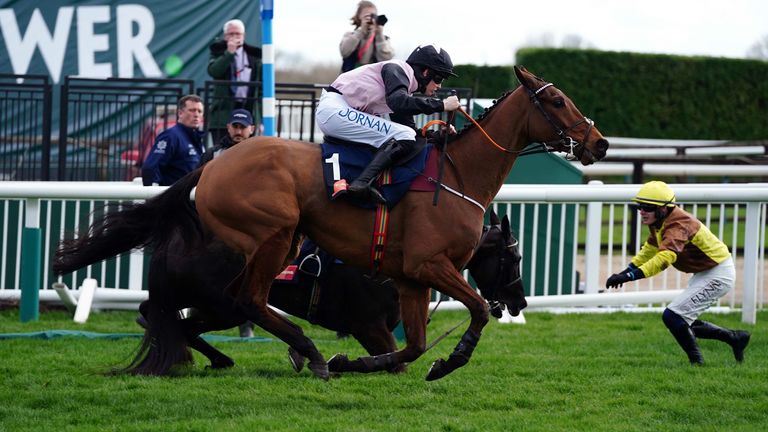 Rachel Blackmore's Bob Ollinger overtakes gallopin des champs riding Paul Taunin on their way to victory in Turners' Novices' Race  Chase on day three of the Cheltenham Festival at Cheltenham Racecourse.  Photo date: Thursday, March 17, 2023.
