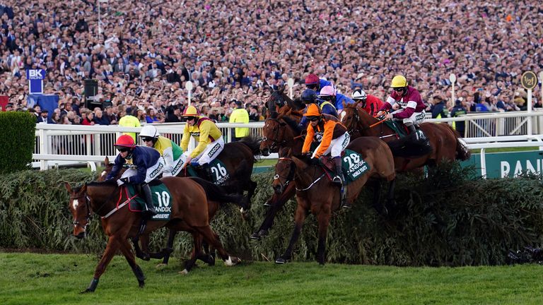 Longhouse Poet goes to the front of the Grand National Square, with Nobel Prize winner Yates (orange hat) chasing