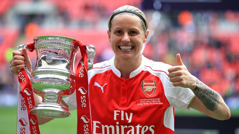 Arsenal's Kelly Smith holds the trophy and celebrates after winning the SSE Women's FA Cup Final at Wembley Stadium, London.