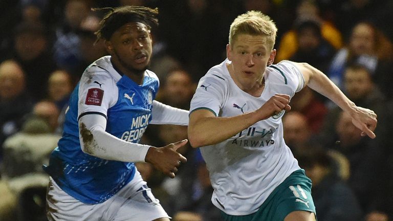 Peterborough Ricky Jade Jones and Man City Oleksandr Zinchenko battle for the ball