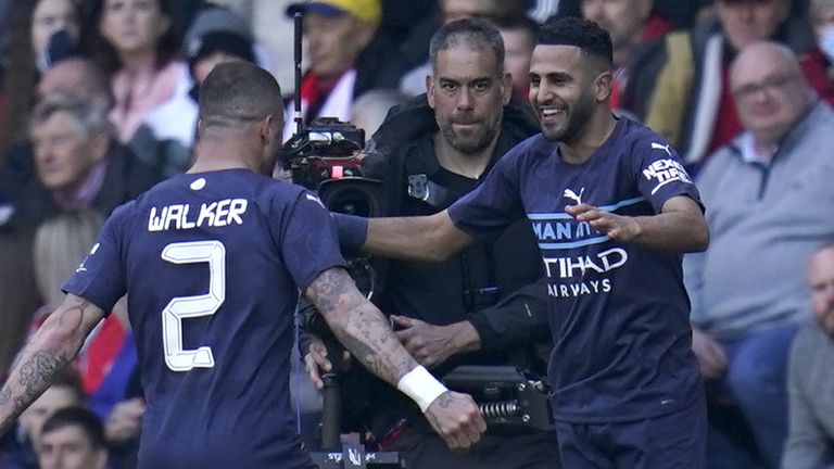 Riyad Mahrez (right) Manchester City celebrates scoring his team's fourth goal in the match