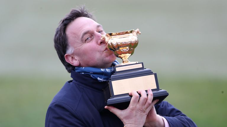 Henry de Broomhead accepts the Cheltenham Gold Cup after the success of Minella Endo