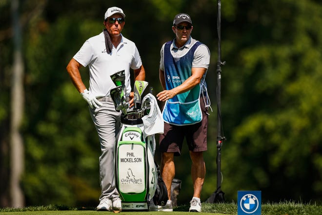 Phil Mickelson and the caddy on the seventh hole during the first round of the 2023 BMW Golf Championship.