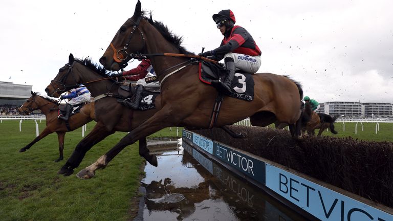 Paint The Dream ridden by jockey Conor Bryce clears the fence on his way to winning the BetVictor Greatwood Gold Cup