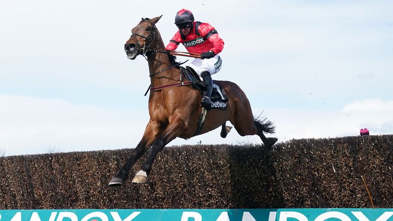 Ahoy Senor is ridden by Derek Fox on their way to winning the Betway Mildmay Novices' Race.  Chasing