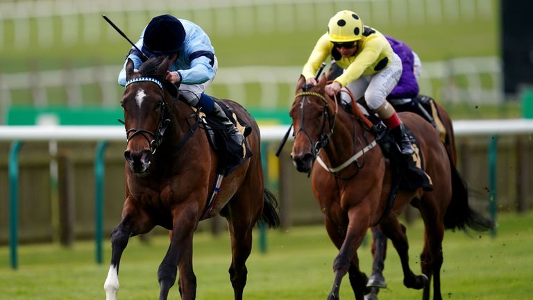 Cachet is ridden by jockey William Buick (left) on their way to winning the Lanwads Nail Gwen Stakes 