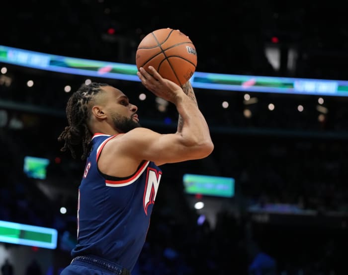 February 19, 2023;  Cleveland, Ohio, USA;  Brooklyn Nets guard Patty Mills (8) shoots during a 3-Point competition during the 2023 NBA All-Star Saturday Night at Rocket Mortgage Field House.  Mandatory credit: Kyle Terada-USA TODAY Sports