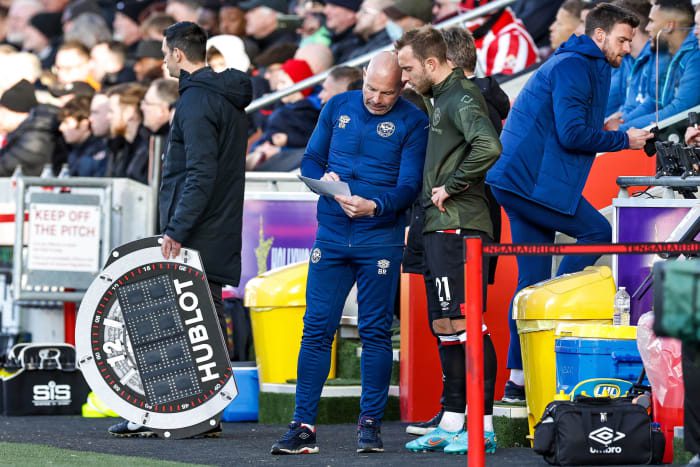 Christian Eriksen receives some final instructions before coming off the bench for Brentford's debut against Newcastle