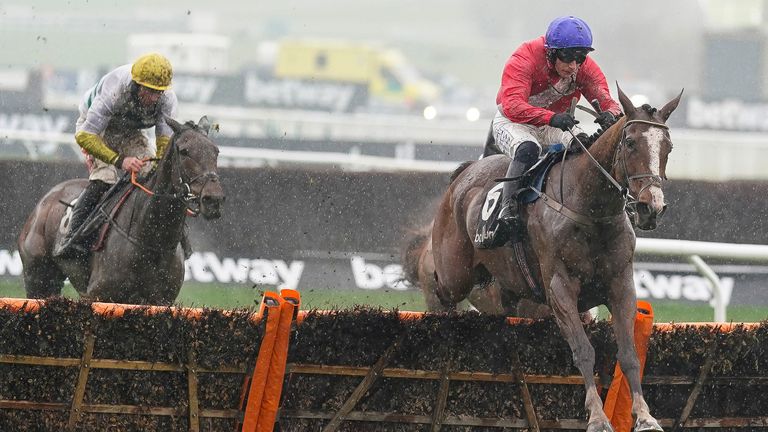 Paul Townend rides Sir Gerhard (in red) and wipes the last to win The Ballymore Novices'  obstacle