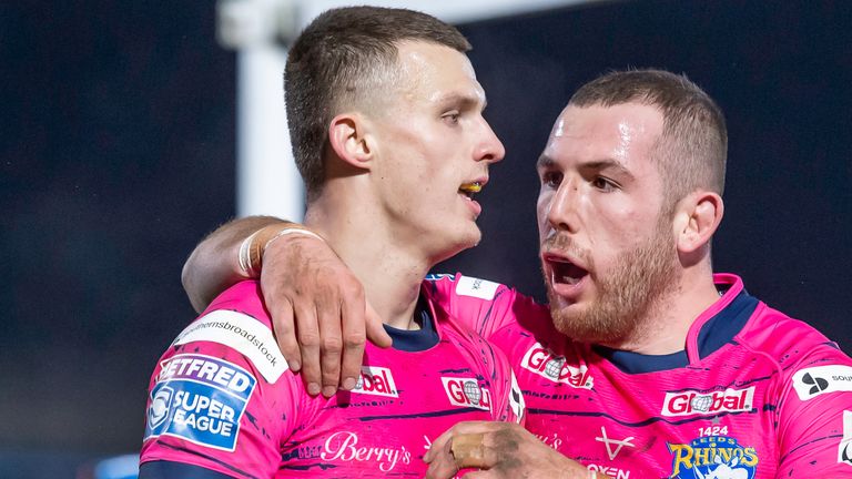 Ash Handley is congratulated by Cameron Smith on scoring Leeds' attempt against Wakefield