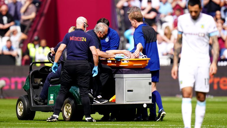 Burnley player Ashley Westwood leaves the field on a stretcher after suffering a serious injury