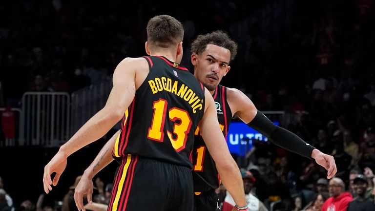 Atlanta Hawks goalkeeper Trae Young and Bogdan Bogdanovic celebrate after the Hawks basket 