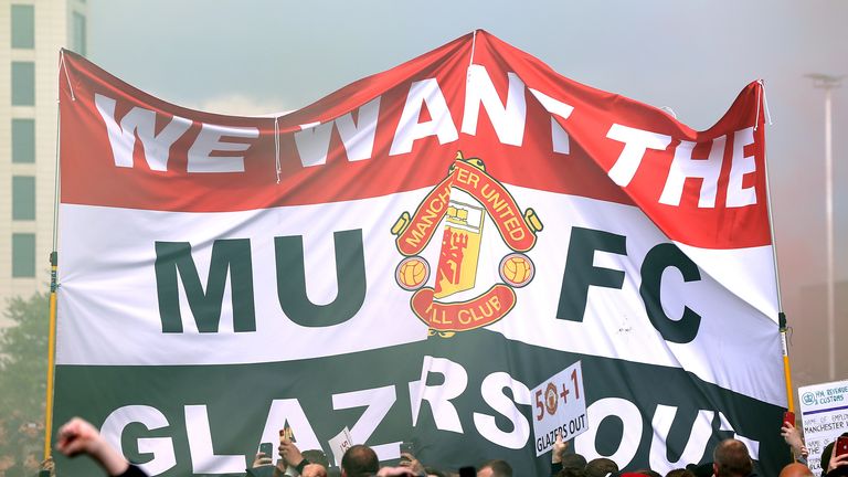 Fans hold a banner as they protest against the Glazer family, owners of Manchester United, ahead of the Premier League match against Liverpool in Old Trafford, Manchester.  Release date: Sunday, May 2, 2023.