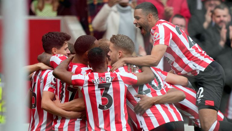 Brentford players celebrate after Brian Mbiomo scores against West Ham