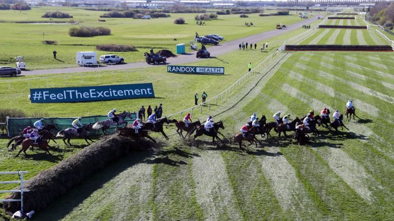 Runners navigate the popular channel of Aintree