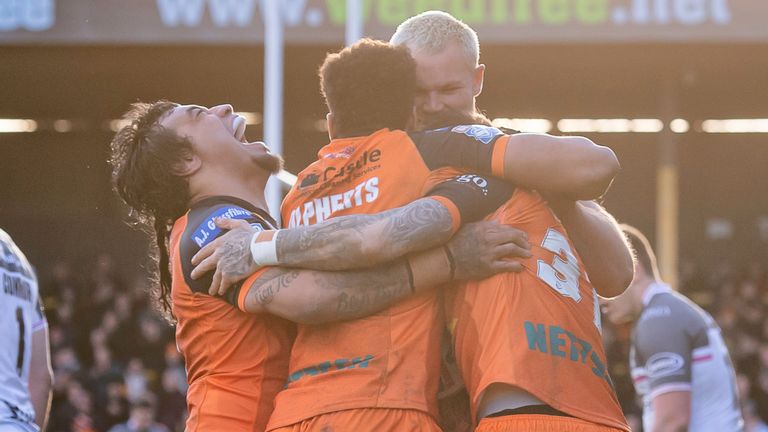Castleford players celebrate their victory over Hull FC
