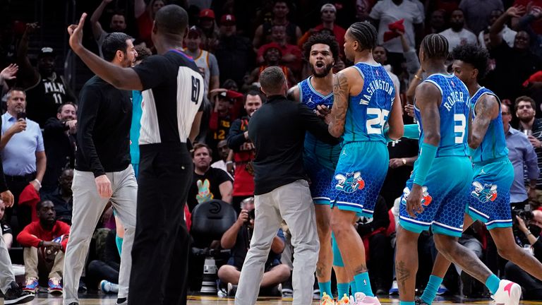 Charlotte Hornets striker Miles Bridges has been handcuffed by PJ Washington and others while arguing with an official after being accused of foul play. 