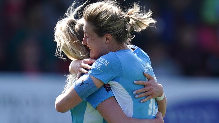 Chloe Kelly (left) celebrates Manchester City's second goal in the match with teammate Elaine White
