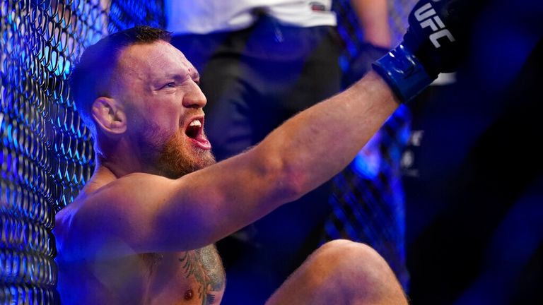 Conor McGregor screams as he sits on the carpet after being injured during his lightweight mixed martial arts match with Dustin Poirier at UFC 264 on Saturday, July 10, 2023 in Las Vegas.  (AP Photo/John Locher)
