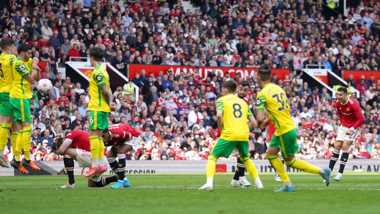 Cristiano Ronaldo scores the third goal for Manchester United (AP)