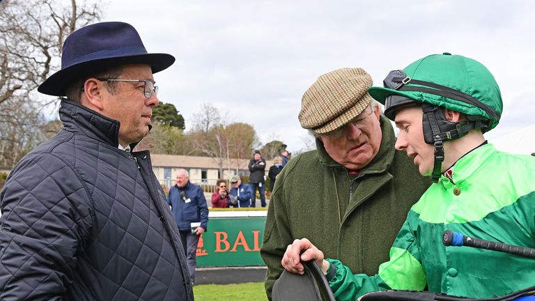 Colin Kane and coach Gere Lyons (left) conduct a debriefing after Dr. Zimpf's win at Leopardstown
