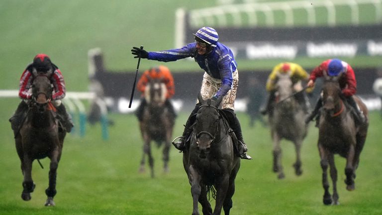 Paul Townend celebrates Energumene's victory in the Chase Championship