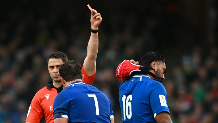 Georgian referee Nika Amashukeli shows a red card to Italian Hame Faiva after reviewing TMO