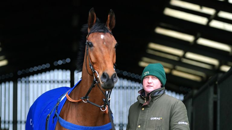 Joe Tizard standing with Grand National player Fiddlerontheroof