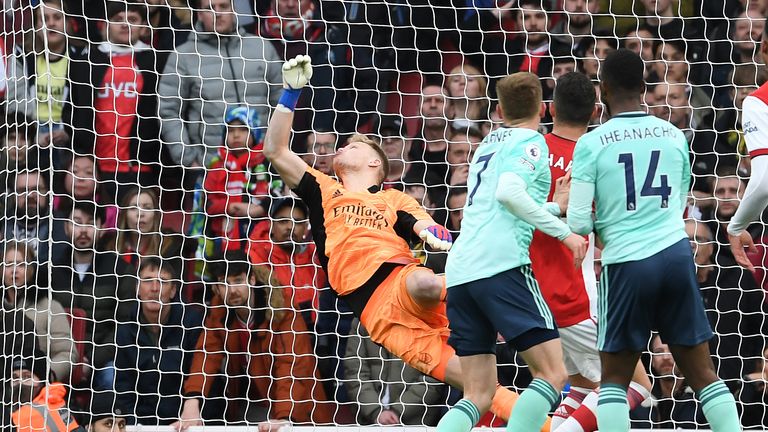 Arsenal goalkeeper Aaron Ramsdale saves from Leicester Harvey Barnes during the Premier League match between Arsenal and Leicester City at the Emirates Stadium on March 13, 2023 in London, England. 