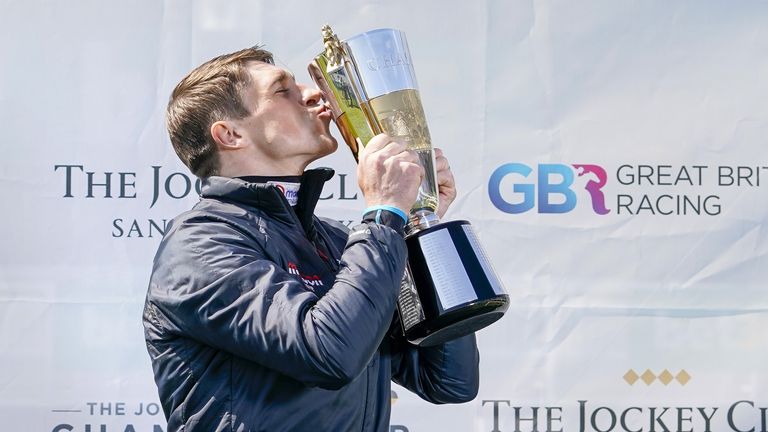 Harry Skelton accepts the trophy after being crowned champion in vaulting