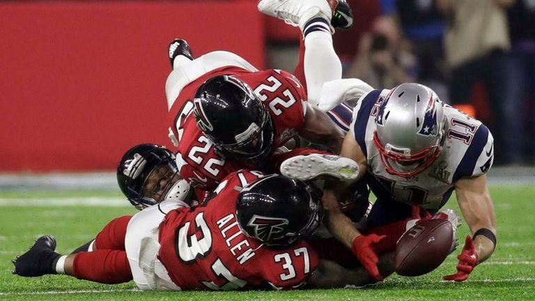 We've picked 10 of our favorite moments from past Super Bowls, including capturing prodigy Julian Edelman and 