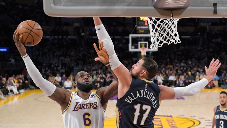 Los Angeles Lakers forward LeBron James, left, shoots as New Orleans Pelicans quarterback Jonas Valanciunas defends during the first half of an NBA basketball game Sunday, February 27, 2023, in Los Angeles