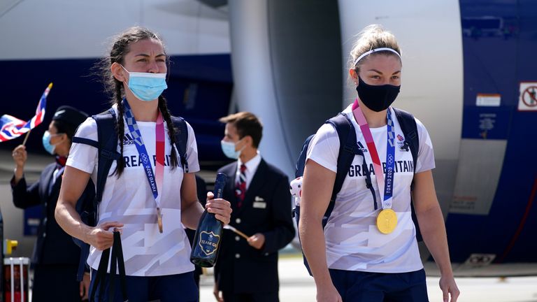 Karis Artingstal of Great Britain (R) and Lauren Price arrive at London Heathrow Airport following the Tokyo 2020 Olympic Games in Japan.