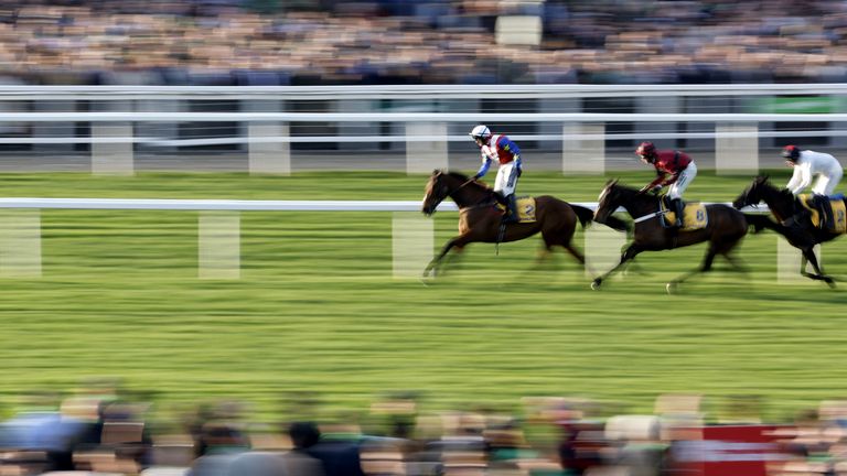 Jonathan Burke stands in the saddle after crossing the front line at the El Maris'  Beginner's & # 39;  Almana in Cheltenham