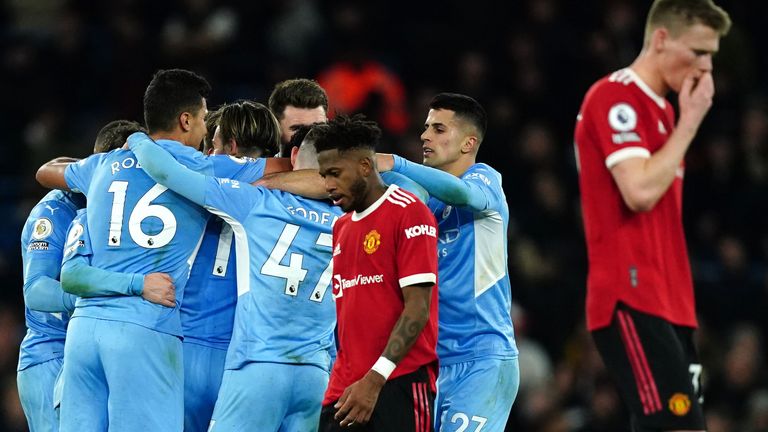 Manchester United players look frustrated after Riyad Mahrez scored Manchester City's fourth goal