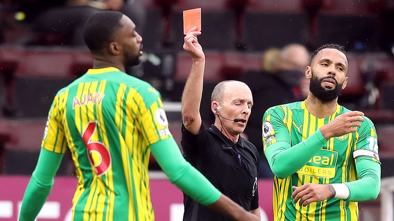 Mike Dean shows the red card to Simi Ajayi 