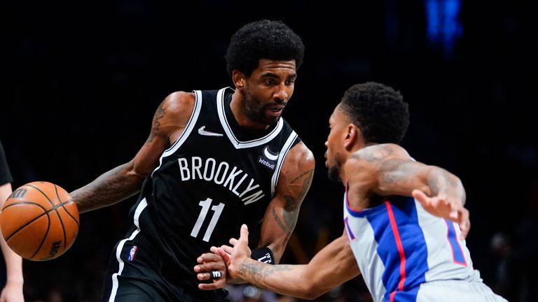 Detroit Pistons'  Rodney McGruder, right, defends the Brooklyn Nets 
