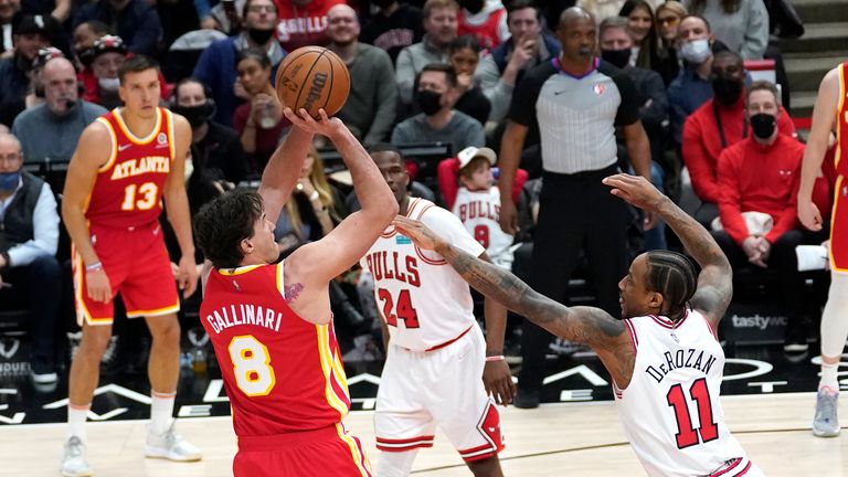 Atlanta Hawks'  Danilo Gallinari (8) shoots the Chicago Bulls'  DeMar DeRozan (11) during the second half of an NBA basketball game Thursday, February 24, 2023 in Chicago.  The bulls won 112-108.