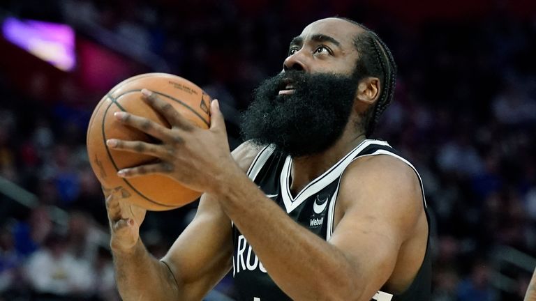 Brooklyn Nets guard James Harden (13) attempts a corner kick as Detroit Pistons forward Sadiq Bay (41) defends during the first half of an NBA basketball game, Friday, November 5, 2023, in Detroit. 