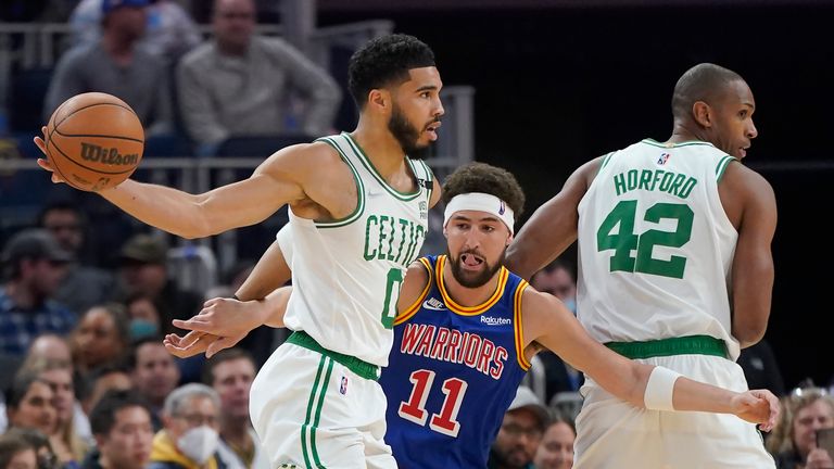 Boston Celtics forward Jason Tatum, left, is defended by Golden State Warriors guard Klay Thompson during the first half of an NBA basketball game in San Francisco, Wednesday, March 16, 2023 (AP Photo/Jeff Chiu)
